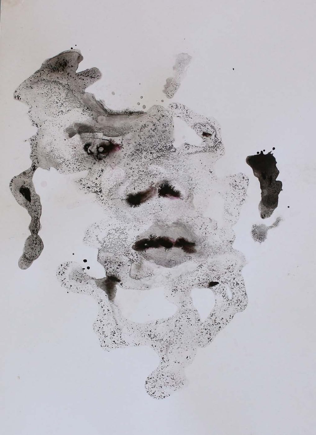 An abstracted face formed from ink blots.