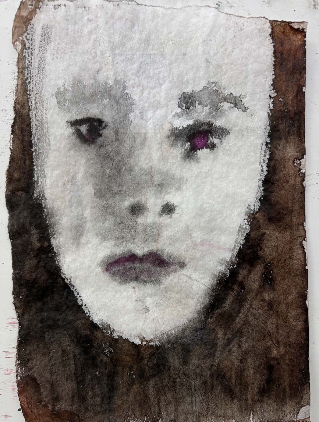 An ink portrait on toned paper.